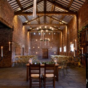 Striking interior photography of the rustic barn wedding venue interior at this historic Buckinghamshire venue setting