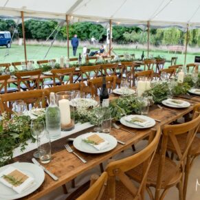 Buckinghamshire photography of a summer festival style rustic wedding marquee interior