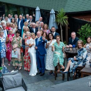 Photography of all the wedding guests captured from above during the wedding drinks reception at this Buckinghamshire pub