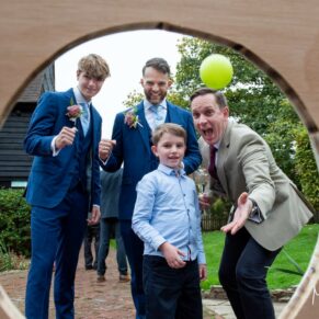 Games photography in the gardens at this Buckinghamshire pub wedding