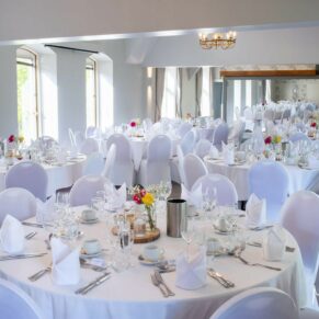 Photography of the wedding breakfast room interior at Badgemore Park in Oxfordshire