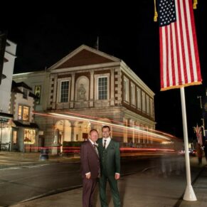 This Macdonald Windsor Hotel wedding couple strike an atmospheric night-time pose outside the Guildhall