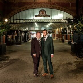 This Macdonald Windsor Hotel wedding couple take a stroll to the railway station after dark for an atmospheric pose under the famous archway