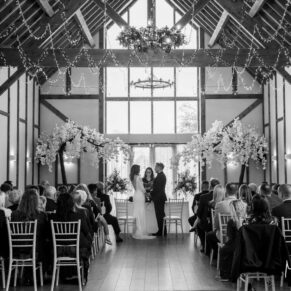 Photography of the indoor civil wedding ceremony in progress at Winters Tale Country Barn in Buckinghamshire