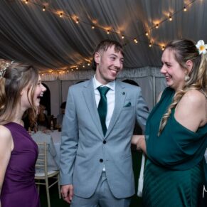 Candid photography capture of some wedding guests at Winters Tale Country Barn taken during the evening reception
