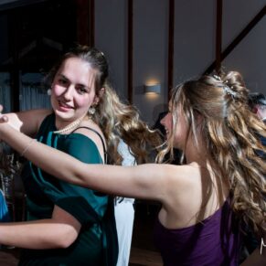 It's energetic wedding dance time at Winters Tale Country Barn for this dramatic photography capture on the dance floor of two ladies