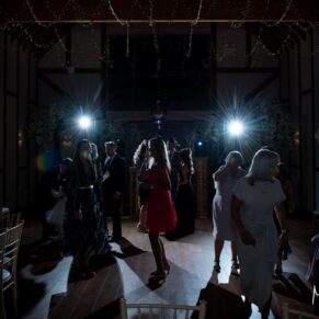 It's energetic wedding dance time at Winters Tale Country Barn for this dramatic photography capture on the dance floor