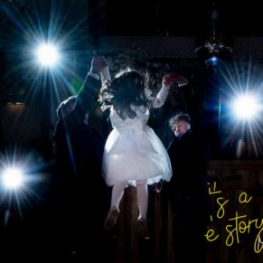 Winters Tale Country Barn wedding photography of the groom and the best man hoisting the flower girl into the air on the dance-floor