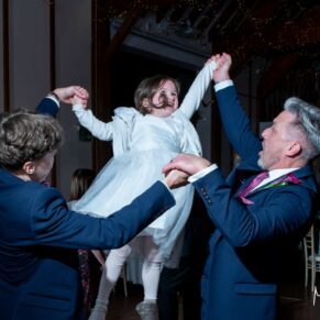 Winters Tale Country Barn wedding photography of the groom and the best man enjoying a high octane dance with the flower girl