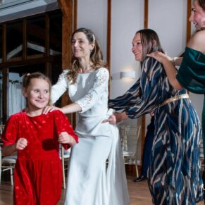 Winters Tale Country Barn wedding photography of the ladies enjoying the party vibes on the dancefloor in the conga line