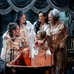 Relaxed bride and bridesmaids photography taken pre ceremony in the copper bath at this Crazy Bear Hotel winter wedding in Stadhampton