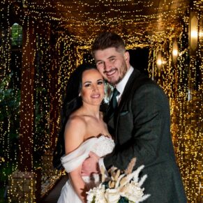 Relaxed photography of the newlyweds in the illuminated light tunnel at their Crazy Bear Hotel wedding in Stadhampton