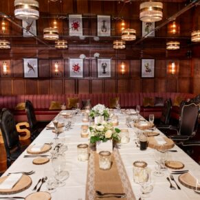 Interiors photography of the Oak Room all set for the wedding breakfast a The Crazy Bear Hotel in Stadhampton